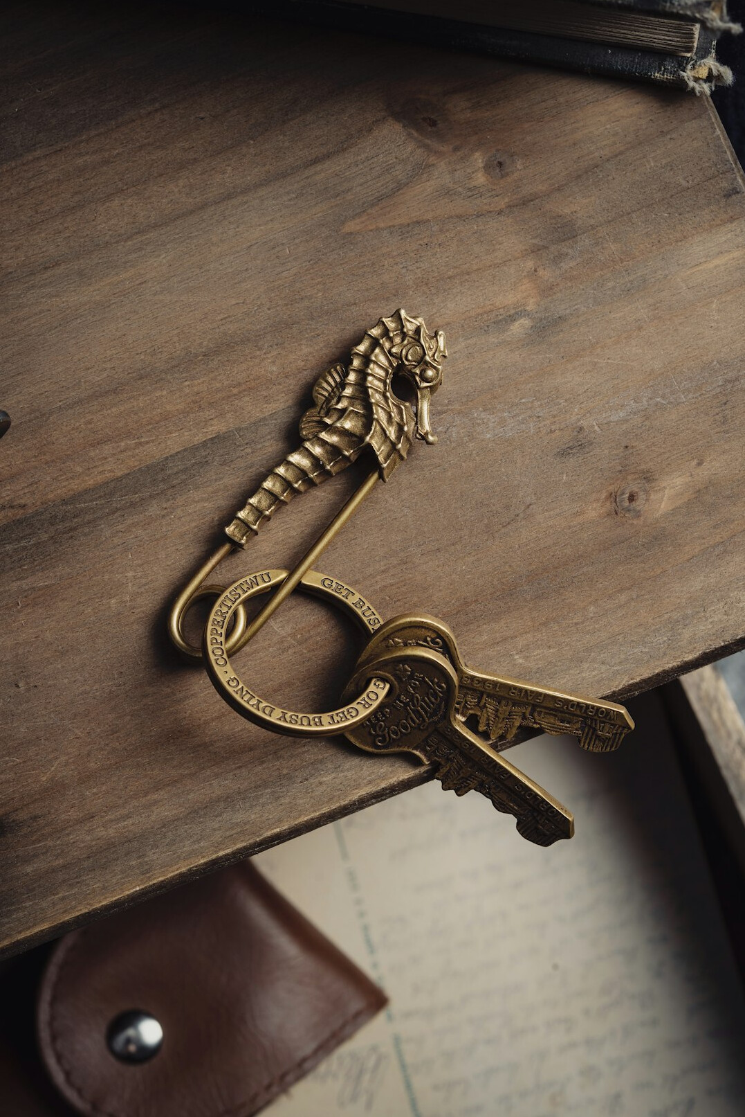 Antique brass key beside an old lock