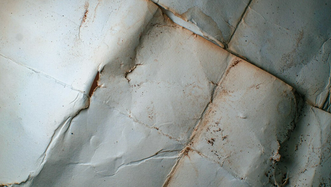 Stack of old documents and papers on a wooden table