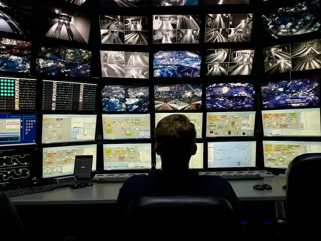 security guard monitoring store cameras