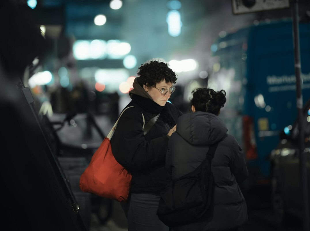 woman hiding item in bag