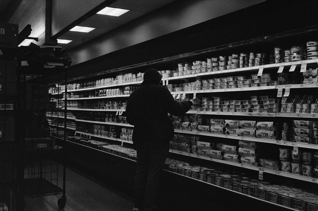 store detective observing customers
